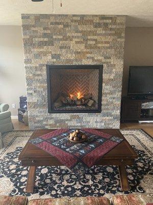 New gas fireplace and stone veneer installation