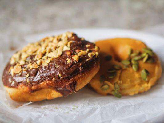 Pumpkin Frosted. Chocolate Peanut. Vegan doughnuts