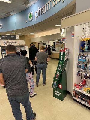 People waiting for the slowest moving pharmacy ever