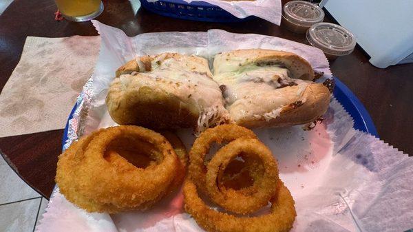 Mozzarella Beef Sandwich with Onion Rings.