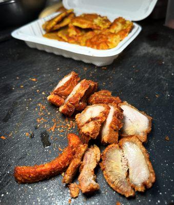 Fried Pork Belly with fried plantains. (Chicharrón de Cerdo con tostones).