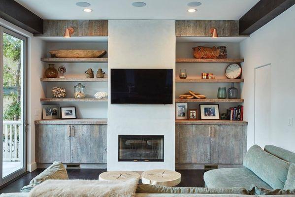 Fitted reclaimed wood cabinets and floating shelves.