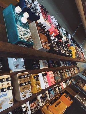 Massive wall of guitar pedals to choose from