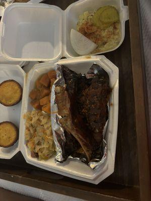 Barbecue ribs, chopped beef, candy, yams, cabbage, cornbread, and potato salad