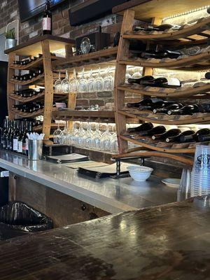 Bar had cute wine rack made of wine barrels.