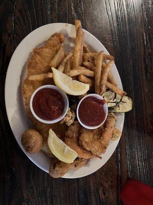 Fisherman's platter with french fries and grilled zucchini.