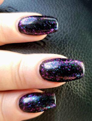 Black gel polish with 002 color glitter top coat.