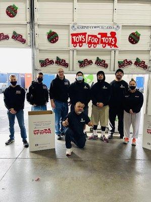 Eco-Movers donating crew and Trucks for Toys for Tots