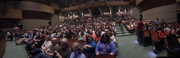 Panoramic shot from in front of the front row. There is a 10 foot gap between the row 1 and the stage.