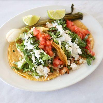 Tacos Gringos: grilled chicken OR steak. Lettuce, tomato, cheese and sour cream.