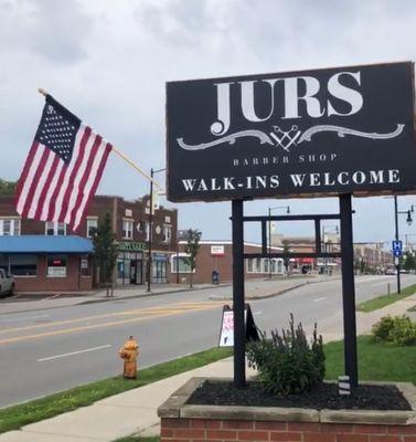 Front sign by the road. Stop in!