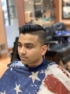 Short tapered sides with a longer textured top