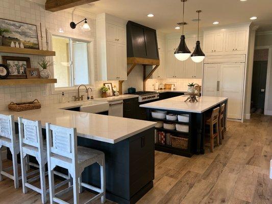 Kitchen cabinets from Shiloh Cabinetry in Polar and Iron Ore.