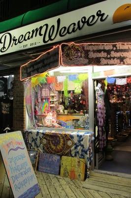 exterior of store from boardwalk, at night