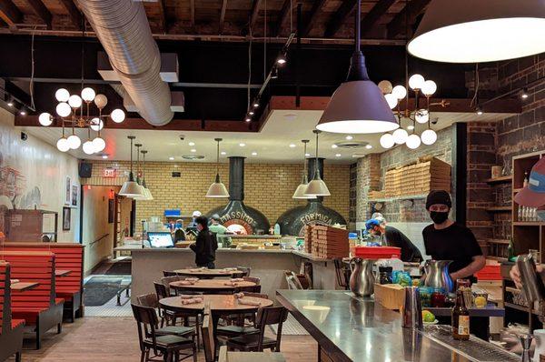 Part of the dining room and the pizza kitchen.