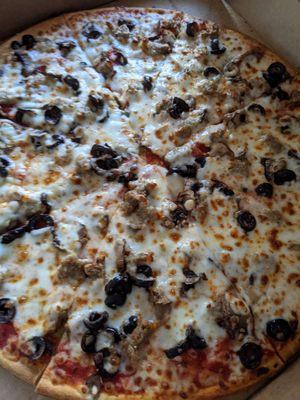 Sausage, mushroom, and olives on thin crust