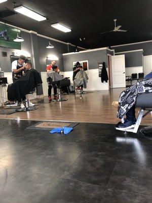 Son getting his cut done while here on Christmas break