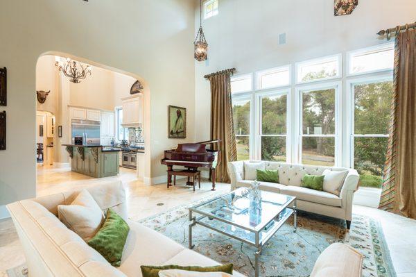 Wall of windows illuminates living area off kitchen in ranch for sale near Gilmer