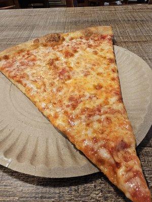 Plain slice. $3.75. Perfectly OK. A bit thinner than most. Cheese quality is alright. A tad greasy. More saucy than cheesy