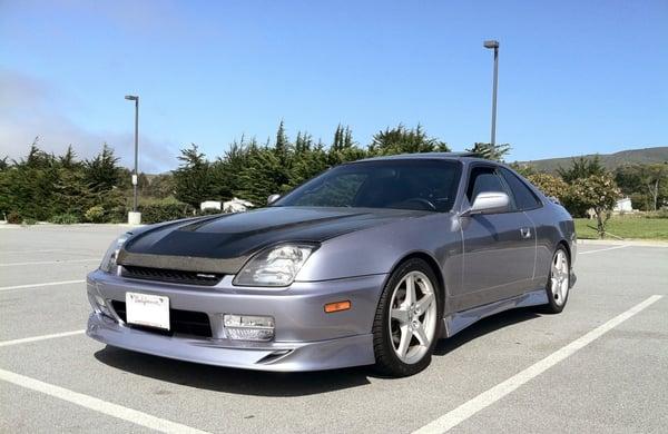 Refinished Carbon fiber Hood, Full Lip kit installation including painting, fog light installation, repaint of front bumper