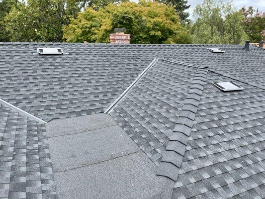 3 layer torch down at flat roof ties into GAF Timberline HD in the color Charcoal