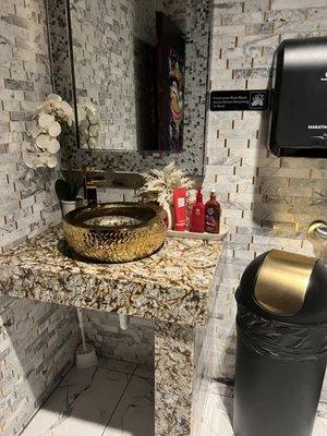 Love the gold in the bathroom