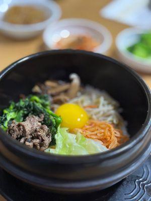 Bibimbap in hot stone. Leave it to cook and the rice gets all nice and crispy!