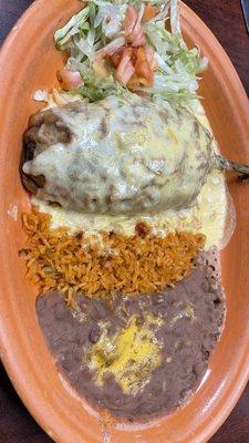 Stuffed chilli relleno in queso sauce and dry beans.