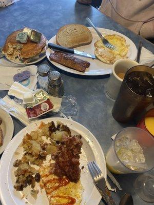 Corn beef hash, eggs, home fries, hot Italian sausage, rye toast, "dippy" eggs, coffee, orange juice