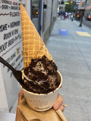 Sea salt and Oreo in a dish with a cone added.