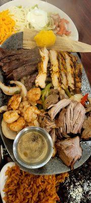 4 Meat Fajitas "chicken, steak, pork, shrimp with chesse, black beans and rice!