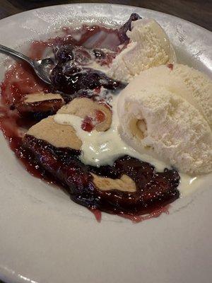 Blackberry cobbler with ice cream.