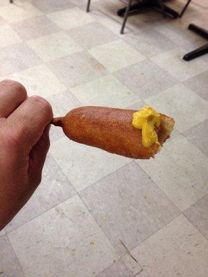 The proper way to garnish any corn dog! Drench it in MUSTARD!