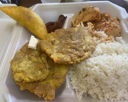 Stewed chicken breast, tostones and some yellow plantains.