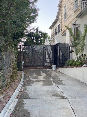 Driveway swinging gate and walk-in door.