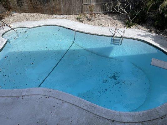 These are photos of our pool spread out between months of service showing how they never cleaned the filter sand out of the pool.