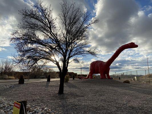 Large Red Dinosaur by the self storage