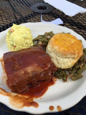 Pork ribs, green beans, potato salad, and a delicious honey butter biscuit.