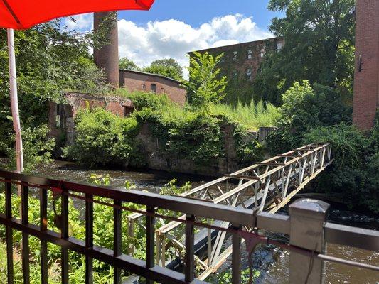 Enjoy your delish beers in the shadow of old mills along the small river.