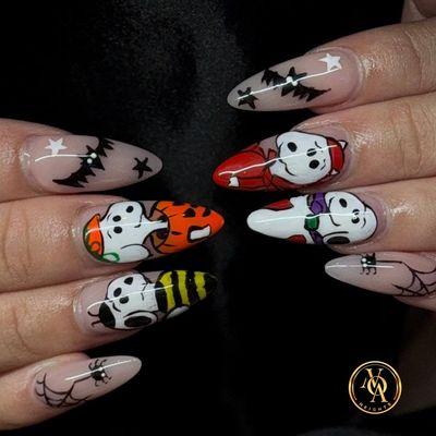 Halloween is creeping up--are your nails ready?
From eerie nail art to bold, dark colors, we've got you covered.