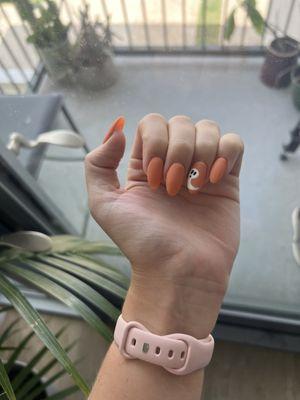 Orange halloween nails with ghost