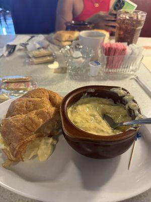 Egg salad sandwich with broccoli cheese soup.