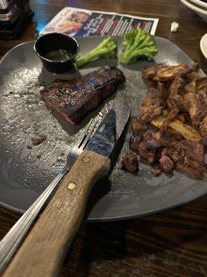 Steak, potatoes and broccoli.