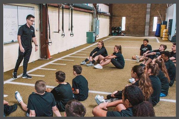 Lead Performance Consultant Kai Laird delivering a workshop to high school athletes.