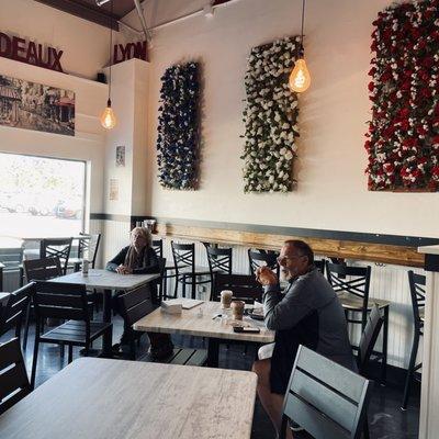 Seating area, decor highlights colors of French flag