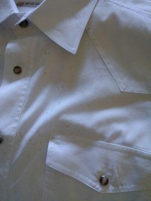 Ruined shirts that were only worn for 4 hours at a wedding--looks like mildew to me.