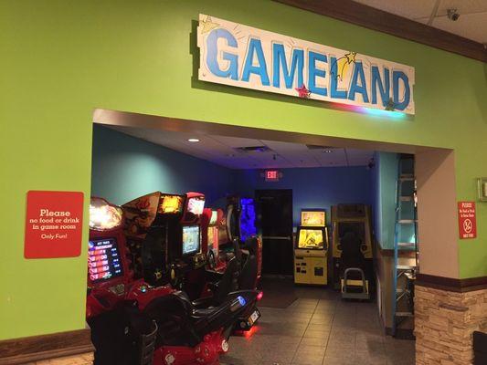 A view of the arcade with the GAMELAND sign in view.