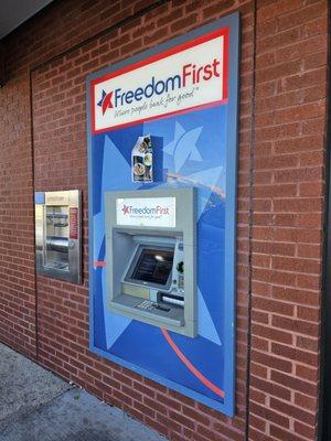 The outside modern ATM machine of the Crossroads branch of the Freedom First Credit Union.