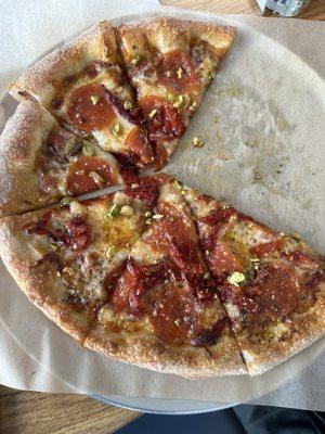 Pizza with pistachios! Pepperoni, honey! Sun dried tomatoes. Sounds weird but very good.