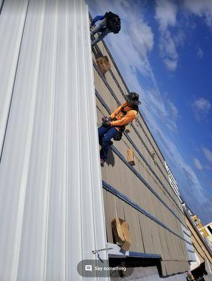 Sub Purling Installation over an existing Corrugated Metal Roofing System, Followed by The New Standing Seam Metal Roofing System.